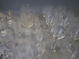 many empty wine glasses sitting on a table