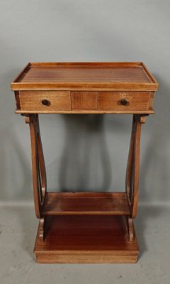 an old wooden table with a drawer on top of it