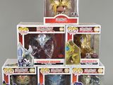 five boxes of action figures are stacked on top of each other