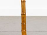 a close up of a bamboo table with a white top