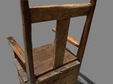 a wooden chair with a wooden seat on a gray background