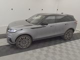 an image of a grey land rover parked in a garage