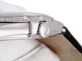a close up of a watch on a white surface