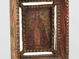 une image représentant un petit cadre en bois orné d'un tableau représentant Jésus