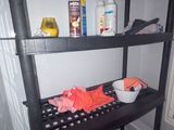 a shelf that has various items on top of it
