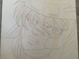 drawing a picture of a girl with a hat and glasses on a sheet of paper