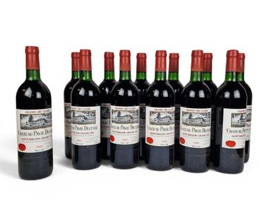 six bottles of red wine are lined up in a row