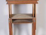 a small wooden table with a shelf on top of it