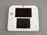 a white nintendo wii game system on a table