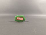 a small green toy that is sitting on a table