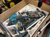 a box full of tools that are sitting on the floor