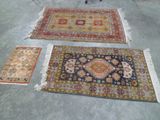 several rugs are laid out on the floor in a room