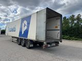 a semi truck that is parked on the side of the road
