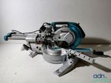 a close up of a circular saw on a white surface