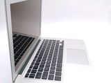 a close up of a laptop computer on a white surface