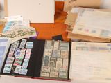 many different types of stamps on the table