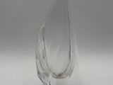 a clear glass vase that is sitting on a table