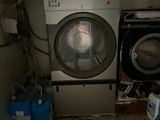 a washer and a dryer in a small room