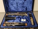 two clarinets in a case with a price tag on it
