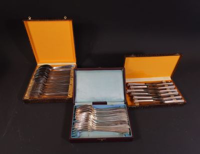 a lot of silverware in a case on a table
