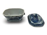 a blue and white bowl and a small bowl on a white surface