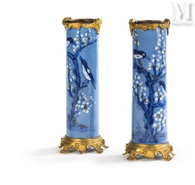 pair of blue and gold vases with birds and flowers on them