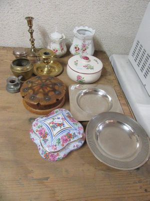 many plates and bowls on a table next to a stove
