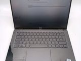 dell laptop computer with keyboard and mouse sitting on a white surface