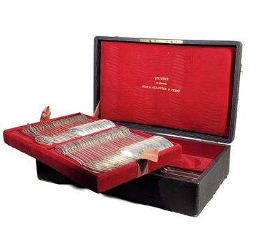 a red case with silverware in it on a white surface