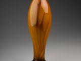 a glass vase that is sitting on a table
