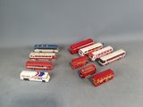 a lot of toy buses that are sitting on the floor