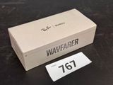 a box with a tag on it sitting on a table
