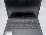 the dell laptop is open and ready to be used