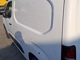 a white van that is parked in the parking lot