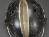 a helmet that has a gold leaf on it