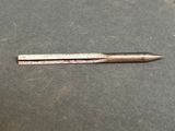 a close up of a small metal object on a table