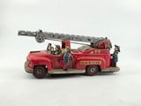 a red toy fire truck with a ladder on the back of it