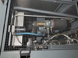 a machine that is sitting inside of a metal cage