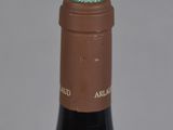 a bottle of wine that has a brown label on it