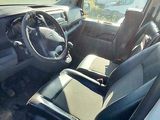 a car that is sitting in the back seat of a truck