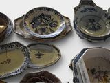 many plates and bowls that are sitting on a table