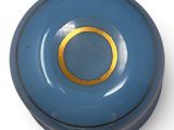 a small blue box with a gold ring on it