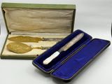 a box with a knife in it and a box with a spoon in it