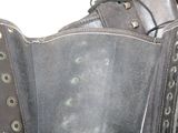 a black leather corset with metal rivets and rivets on it