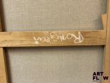 a picture of a wooden frame with writing on it