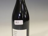 a bottle of wine that is sitting on a table