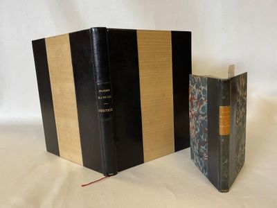 two books sitting on top of a table next to each other