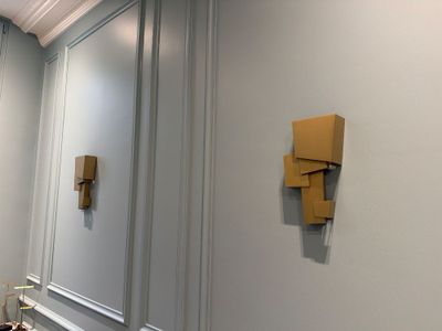 a picture of a bathroom with a toilet and a mirror
