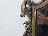 a man that is standing in front of a mirror