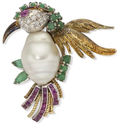 an image of a white pearl and emerald bird broochle